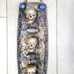 3 Skulls on a Spiked Plaque