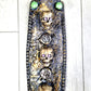 3 Skulls on a Spiked Plaque